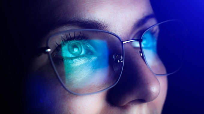 Girl Works On Internet. Reflection At The Glasses From Laptop.
Close Up Of Woman's Eyes With Black Female Glasses For Working At A Computer. Eye Protection From Blue Light And Rays.